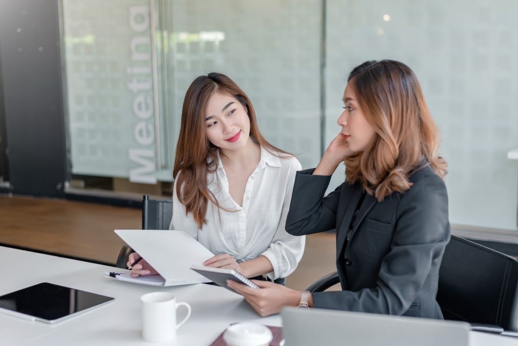 Happy asian businesswoman working together in the office.